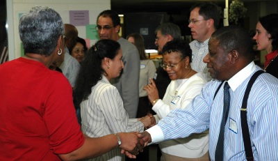 Participants in the county's race relations study circles meet each other in an opening exercise. Linda Suggs greets Mac McClintock and Lalitha Racindrananth welcomes Jeanette Pettit. Study circles are groups from different backgrounds and viewpoints who meet to explore race relations and local solutions to racism. Photo courtesy of SMCM.