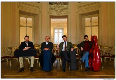 Members of the Artis String Quartet of Vienna, who play while standing, relax before their latest world tour, which includes a stop at St. Mary's College of Maryland.