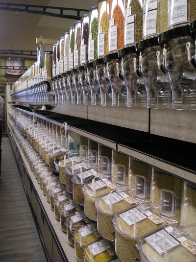 One way to reduce food packaging waste is to buy in bulk. Most natural foods stores have large bulk-buying sections, like the one pictured here, so you can haul away in large bags the equivalent of many containers of beans, pastas, rice or other staples. (Photo: mattieb, courtesy Flickr)