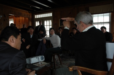 Robert Paul (right) describes to Chinese delegates from the Yellow River Conservancy efforts to protect the St. Mary's River from run-off and sedimentation, problems affecting China's Yellow River to a much greater degree.