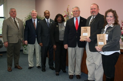 Pictured with the Commissioners: Mr. Wayne Magoon, Sales Vice President, Beacon Printing (second from right), and Ms. Mindi Roberts, Marketing Director, Chick-fil-A at Waldorf (far right). (Photo: George Clarkson)
