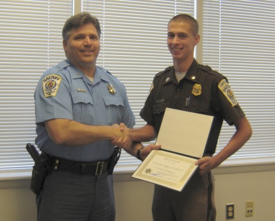 Correctional Officer Will Thompson accepts his Officer of the Quarter award for Q4 2007 from St. Mary's County Sheriff Timothy Cameron.
