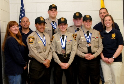 Charles County Sheriff’s Office Explorers recently won a handful of medals — two gold — at the Explorers Olympics held near Memphis, Tenn. Pictured from left to right are Lori Windsor, Cpl. Rhett Calloway, Kateria Yates, Joseph Hughes, Andrea Duckett, Victor Kavaky, Shannon O’Hara, Sgt. Bill Donley and Officer Erin Horton. (Photo: CCSO)
