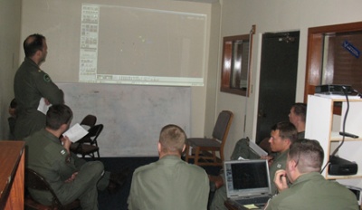 Navy aircrews on Guam using NAVAIR's Tactical Combat Training System (TCTS) system to debrief their latest mission. (U.S. Navy Photo)
