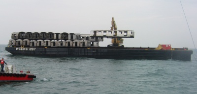 Retired New York City subway cars are dropped into the Atlantic Ocean near Ocean City, Maryland to create an artificial reef. Officials hope the reef will attract large numbers of fish which in turn will help the sport fishing industry thrive. (Photo: Md. DNR)
