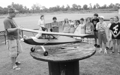 Matt Tillman, president of Patuxent Aeromodelers club talks to some campers about the ins and outs of flying model airplanes. (Photo: Guy Leonard)
