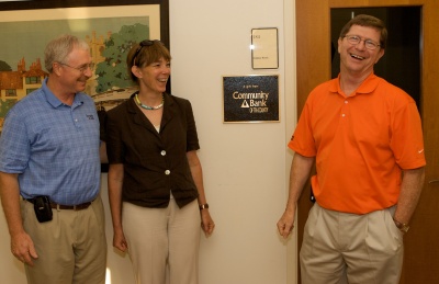 St. Mary's College of Maryland President Jane Margaret O'Brien, Community Bank of Tri-County President Michael Middleton (right), and Vice President Greg Cockerham celebrate the naming of a room in Goodpaster Hall after the bank in honor of a $25,000 gift to the College for students from Southern Maryland. (Photo: Eric Heisler)