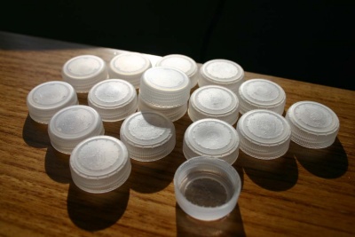 Many recycling centers do not accept plastic lids, tops and caps. They are usually made of a different plastic than the containers they accompanied and can contaminate the recycling stream while also causing machine jams and injuries to workers. (Photo: GregPC, courtesy Flickr)