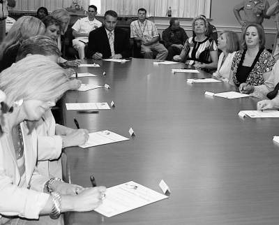 Principals from 15 schools in southern Maryland renewed their partnership agreements with Patuxent River Naval Air Station at a ceremony on Tuesday, Sept. 9. (Photo: Andrea Shiell)