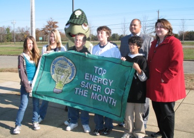 Students and school officials from Leonardtown Middle School display the top Energy Saver of the Month flag. They were the first school in the county to receive the award. (Submitted photo)