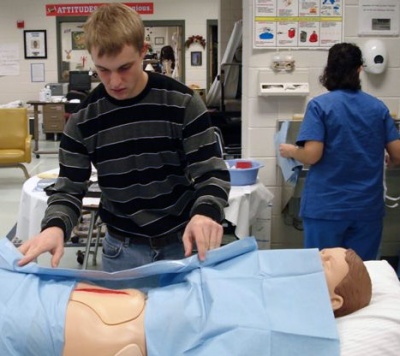 Technical center student Jarod Stevenson practices dressing a patient during a visit from two St. Mary’s Hospital nurses on Nov. 13. (Submitted photo)