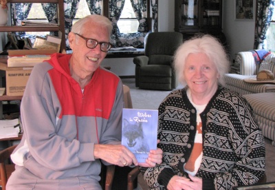 Former National Security Agency linguist Will Graves, 81, displays his 2007 book, "Wolves in Russia: Anxiety Through the Ages," at his Millersville home with wife Randi Graves. (Photo: Anath Hartmann)