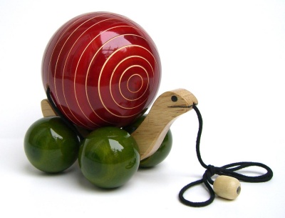 The Internet is teeming with online stores, catalogs and environmental groups that sell green-friendly gifts for the holidays. Pictured here: a child's snail pull-toy from Earthentree, made by artisans in India from sustainable wood that is dyed with natural vegetable dyes and finished with lead free non-toxic organic resin. (Photo: Earthentree)