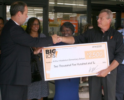 Arthur Middleton Elementary School Principal Greg Miller, far left, accepts a $2,500 donation from Big Lots Inc. to the school from Paul Bergen, district manager of the Waldorf store, far right. Also pictured are Jacquelyn White, reading resource teacher at Middleton, second from left, and Middleton Vice Principal Patricia Mooring, second from right. (Submitted photo)