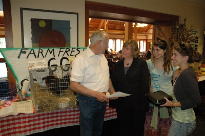 John Dalton, of Dalton’s Orchard and Apiaries; St. Mary’s College of Maryland dean of students Laura Bayless; and Master of Arts in Teaching student Rachel Clement’08 and Katie Mazzocco’10 discuss chickens from his farm behind him and the fresh eggs he provides the college every day. (Submitted photo)