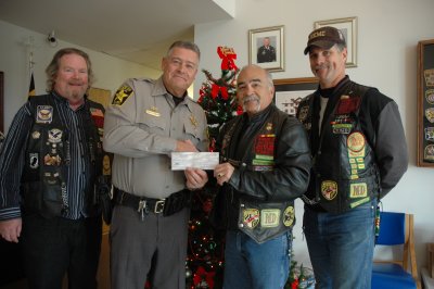 Pictured, left to right, Nam Knight Secretary Steve "Spatz" Logan, Sheriff Mike Evans, President of the Old Line Chapter-NK Ray "Bomber" Nieves and Chaplain NK Bill "Preacher" Collette.