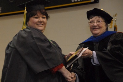Patricia Hall of Avenue receives the Achievement in Nursing Award from CSM Health Services Division Chair Sandy Genrich at CSM's 10th Winter Commencement. (Submitted photo)