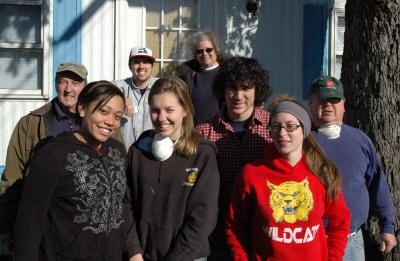 Christmas in April volunteers from St. Mary’s College of Maryland and St. Mary’s County worked in 30 degree weather yesterday morning on their first project of the year. The volunteers cleared the underside of a trailer to make room for a furnace and major bathroom repairs, neither of which were installed in the home housing a woman and her three children. First row, left to right: SMCM student Taylore Mountain ’10, of Woodbridge, Virginia; SMCM student Lauren Ramsay ’10, of Ellicott City, Maryland; SMCM student Danny Marris ’10, of Parkville, Maryland; SMCM student Stephanie Hartwick ’10, of Lexington Park, Maryland; (second row, left to right) Bob Morehouse; SMCM student Donald Redmiles ’10, of Annapolis, Maryland; Mary Ann Chasen, executive director of St. Mary’s County Christmas in April; and Fred Morton. (Submitted photo)