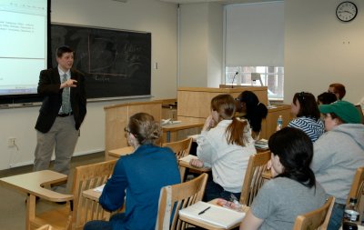 Todd Eberly, an assistant professor of political science and the coordinator of public policy studies at St. Mary’s College of Maryland, shown lecturing students, completed a study that examines the impact of Maryland's Medicaid program on 260,000 children as the program was expanded during the past decade. (Submitted photo)
