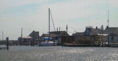 A dock sits close to private homes along Smith Island's coastline. (Photo by Maryland Newsline's Ben Giles)