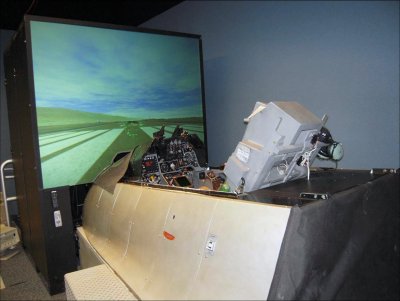 The newly installed F-16A/B Fighting Falcon cockpit simulator at Naval Strike and Air Warfare Center (NSAWC), Naval Air Station Fallon, Nev. U.S. Navy photo.