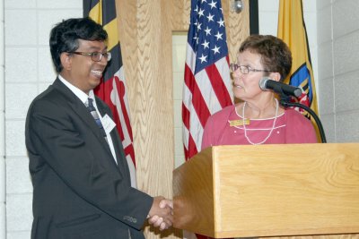 Charles County Board of Education Chairman Roberta S. Wise, pictured right, welcomes Dr. Amitabha Ghosh, a NASA geologist assigned to work the Mars rover missions, pictured left, at the Charles County Public Schools (CCPS) fourth Educational Exchange, held Aug. 3 at North Point High School. (Submitted photo)