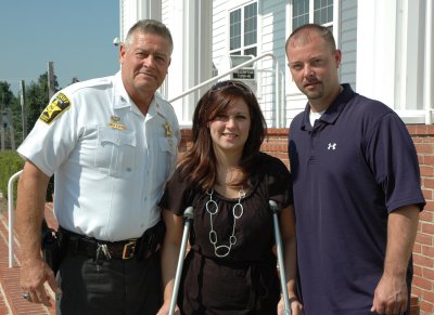 Pictured from left: Sheriff Mike Evans, Kerri Ann Stallings, and Michael Baxter.