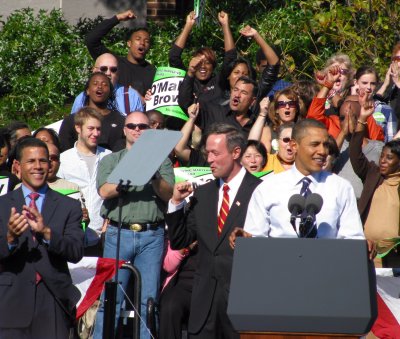 President Obama, on stage with Gov. Martin O'Malley and Lt. Gov. Anthony Brown, encourages the crowd to vote for Democrats in November at a rally Thursday at Bowie State University. Capital News Service Photo by Alix Farr.