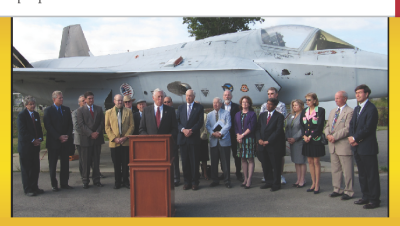 This photograph, captured from a political ad paid for by the Hoyer for Congress Committee, shows Democrat candidates Steny Hoyer, John Bohanan, and Jack Russell standing in front of a retired Navy Jet on what is known as the "Flight Line" on Naval Air Station Patuxent River. Also in the photo is retired long-time DoD employee Robert Waxman, former executive director of Webster Field, and Former NAS Commander Capt. Glen Ives (Retired). Navy and museum officials say the entourage showed up unannounced and did not seek advance permission from the Navy or the Air Museum. Caption by somd.com. [ Click photo for larger rendition ]
