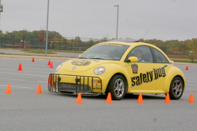 North Point High School junior Alexander Colaciello drives the Lookin Out Safety Bug through the course in the parking lot on Oct. 26. The event was sponsored by Strachan Insurance Company and facilitated by the Pennsylvania Driving Under the Influence (DUI) Association. The event was held as part of the school system’s “We Care” teen driving campaign. (Submitted photo)