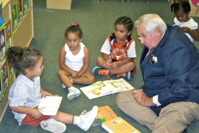 Superintendent of Schools James E. Richmond, pictured right, talks with three-year-old students, from left, Devontae Russell, Kalia Woods and Jakei Cobb. (Submitted photo)