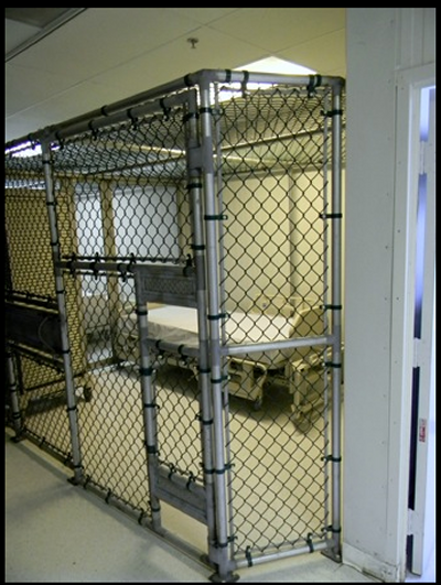 The prisoner medical facility features an intensive care unit with individual beds in separate cages. (Photo: Laura Lee)