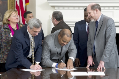 In Annapolis, CSM President Dr. Brad Gottfried, left, signs the Maryland Campus Compact for Student Veterans which aims to improve on-campus services for veteran students. The college has had a veterans affairs coordinator since 2008. (Photo: Office of Md. Governor)