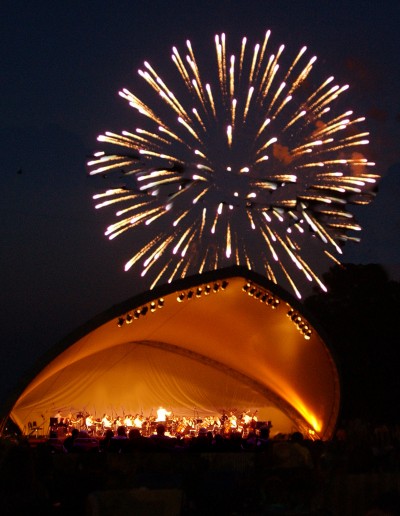 Fireworks explode in the background over the concert pavilion on the campus of St. Mary's College of Maryland in a previous year's River Concert. (Submitted photo)