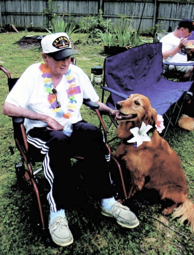 Ed Lennon and Maggie relax during the golden retriever afternoon. (Photo: Sarah Miller)