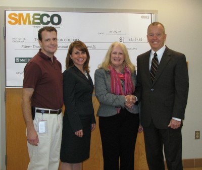Southern Maryland Electric Cooperative presents its contribution to the Center for Children. Pictured from left are John Barrett, SMECO Purchasing Supervisor, Kimberly Rosenfield, President of the Board of Directors of the Center for Children, Catherine Meyers, Executive Director of the Center for Children, and Austin J. Slater, Jr., SMECO President and Chief Executive Officer. (Submitted photo)