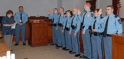 New deputies are shown being sworn in after graduation from the police academy. From left to right: Deputy Timothy Shomper, Deputy Austin Schultz, Deputy Vincent Pontorno, Deputy Joshua Krum, Deputy Christopher Beyer, Deputy Dinara Beasley, and Deputy William Bankhead. (Submitted photo)