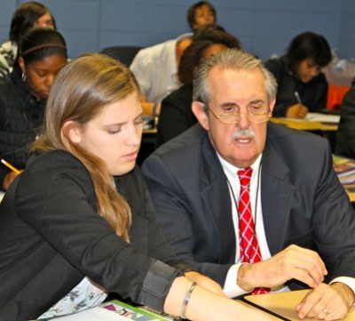 Interim State Superintendent of Schools Bernard Sadusky, right, talks with Danielle Rovnak, left, of Westlake High School following a Telepresence demonstration and class.