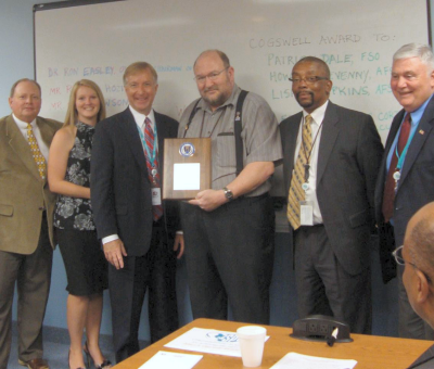 System Planning Corporation employees, from left, Howard Devenny, Air Warfare Group AFSO, Lisa Lumpkins Air Warfare Group Asst. FSO, with the CEO of Corporate System Planning Corporation in Arlington, Va. – Richard Hozik, Patrick Dale, Air Warfare Group FSO, Leon Jones of SPC Corporate FSO, and Sr. Vice President of the Air Warfare Group in Lexington Park, James McFillin. (Photo: The County Times)