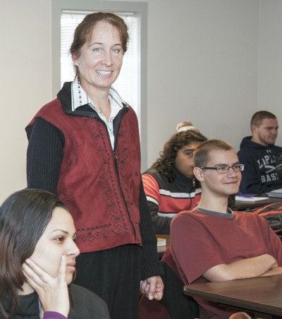 Dr. Mary Beth Klinger (standing), recently honored with the College of Southern Maryland's Faculty Excellence Award for full-time faculty, believes in the power of education to open doors, and she says that she tries to impart that philosophy from the first day of class.