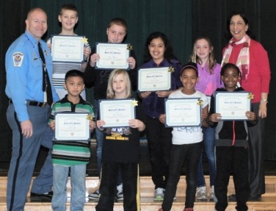 Captain Steve Hall awarded eight Greenview Knolls students with Sheriff's Salutes and appointed them as St. Mary's County Sheriff's Office Junior Deputies.