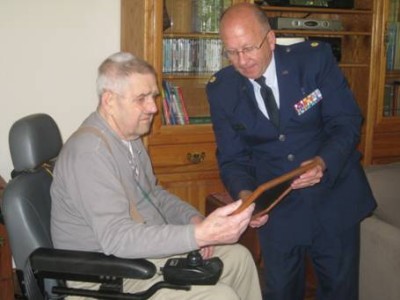 James O. Parker receives a plaque honoring his military service from Major Linzy Laughhunn, a Chaplain in the Air National Guard and also Calvert Hospice Bereavement Coordinator. (Submitted photo)