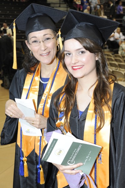 Brenda Minshall, left, and her daughter Sophia Minshall, of Mechanicsville, gather before the processional of CSM's 2013 Spring Commencement. Sophia Minshall urged her mother to attend CSM with her and on May 16 they graduated together.