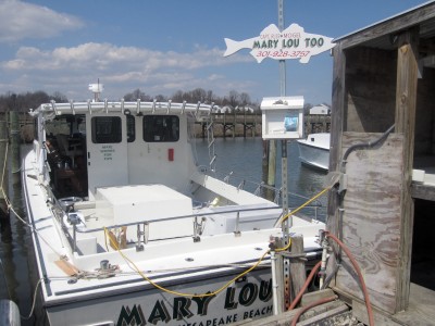 The Mary Lou Too charter fishing boat is docked in Fishing Creek. Captain Russ Mogel says he loses business when the tides are too high to slip under the Rte. 261 bridge. (Photo: Sydney Paul)