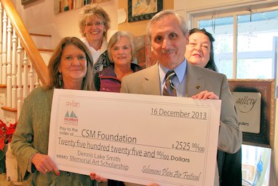 Avian Solomons Plein Air Festival Chair Carmen l.n. Gambrill, front left, presented $2,525 in festival proceeds to benefit the Dennis Lake Smith Memorial Art Scholarship at the College of Southern Maryland to CSM President Dr. Brad Gottfried, right. Festival committee members included, rear from left, CSM Community Relations Senior Executive Director Karen Smith Hupp, Paula Moeller and Solomons Business Association Board Member and BlueShift Marketing's Vandy Young. (Submitted photo)
