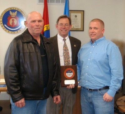 Charlie (left) and Chris Guy (right) of Two Guys Collision Center accept the "Our Town Award."