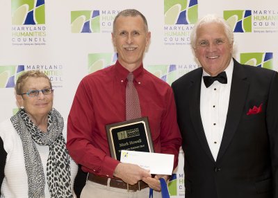 Westlake High School history teacher Mark Howell, pictured center, received the Maryland History Day Patricia Behring Teacher of the Year Award last month and was congratulated by Joyce Leviton, left, of Sen. Ben Cardin's office, and Maryland Senate President Mike Miller, right. (submitted photo)
