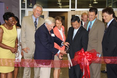 Maryland State Superintendent of Schools Dr. Lillian Lowery joins, from left, former CCPS Assistant Superintendent for Supporting Services Charles Wineland, former CCPS Superintendent James Richmond, CCPS Superintendent Dr. Kimberly Hill, Dr. Leroy Chiao, Space Foundation Vice President of Education/Discovery Iain Probert and Charles County Commissioner Ken Robinson in a ribbon cutting ceremony for the Science Center, located at St. Charles High School, held July 29. The Science Center opens to the public on the first day of school for CCPS students, which is Aug. 25. A public event is planned for Saturday, Sept. 6. (Submitted photo)