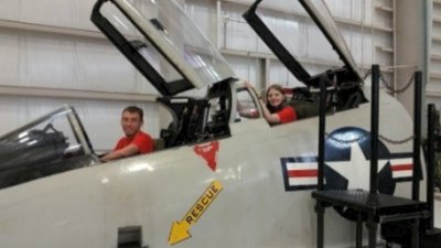 Zoe Lambert and flight partner Seth Keller take a moment to enjoy an interactive display at the National Naval Aviation Museum while attending the National Flight Academy’s Ambition program in Pensacola, Florida. (Submitted photo)