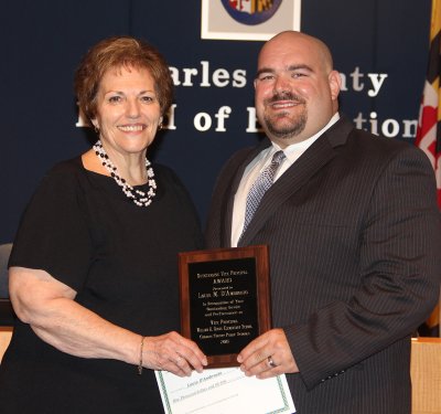 William A. Diggs Elementary School Vice Principal Louis D’Ambrosio, right, was honored by the Board of Education on June 9 as the 2015 Charles County Public Schools Vice Principal of the Year. Board Chairman Virginia McGraw, pictured left, presented D’Ambrosio with a plaque of recognition during the June 9 Board meeting. CCPS honors one outstanding vice principal per year.